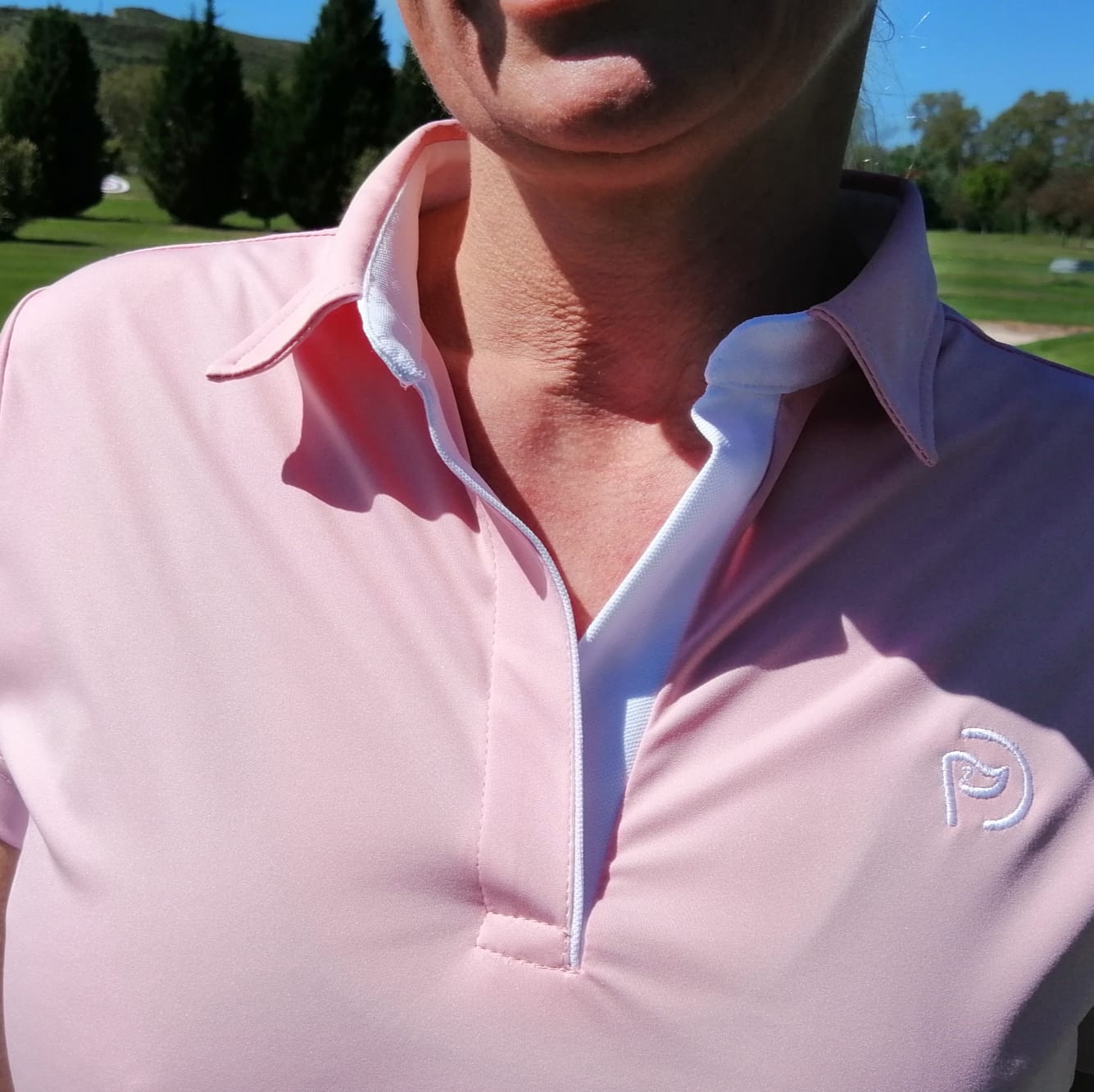 Polo de golf rosa y blanco, UPF 50+, mujer