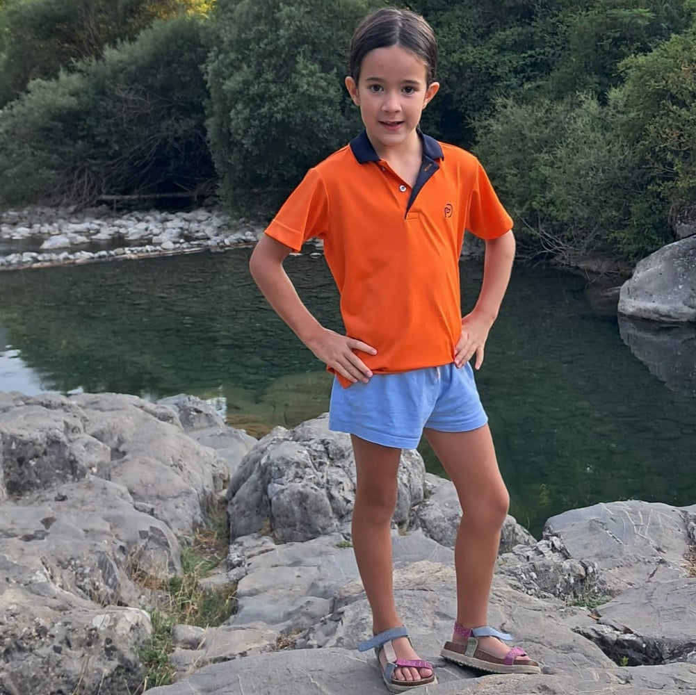 Polo técnico golf naranja kids, muy alegre y favorecedor