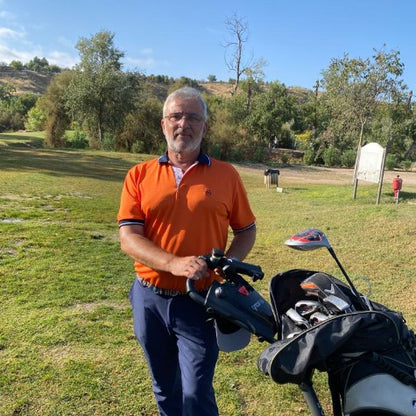Polo de golf en color naranja para hombre